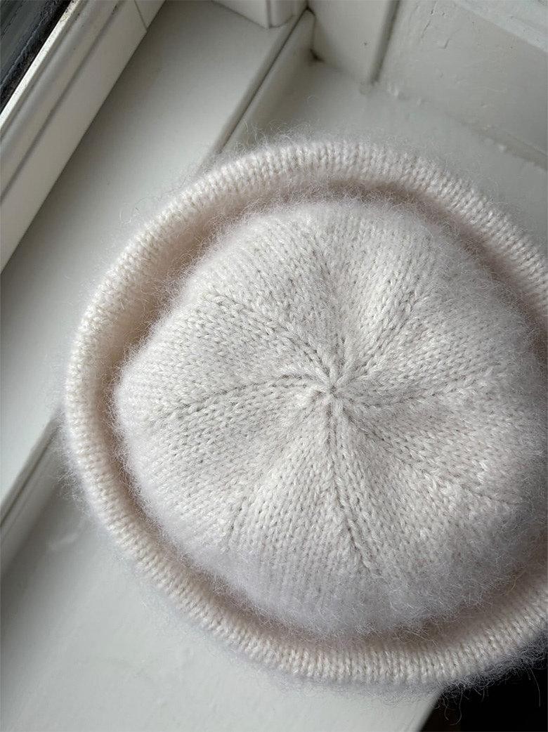 Пушистая вязаная шапка с высоким отворотом описание